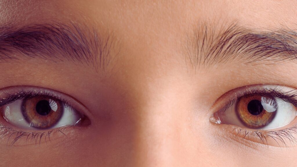 Close-up of child’s eyes illustrating autism and eye contact patterns, including visual attention and social communication differences.