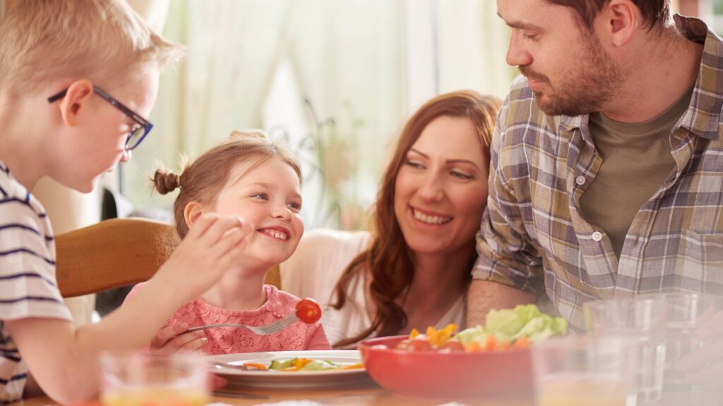 Family sharing a meal together at home after considering parent involvement in ABA therapy