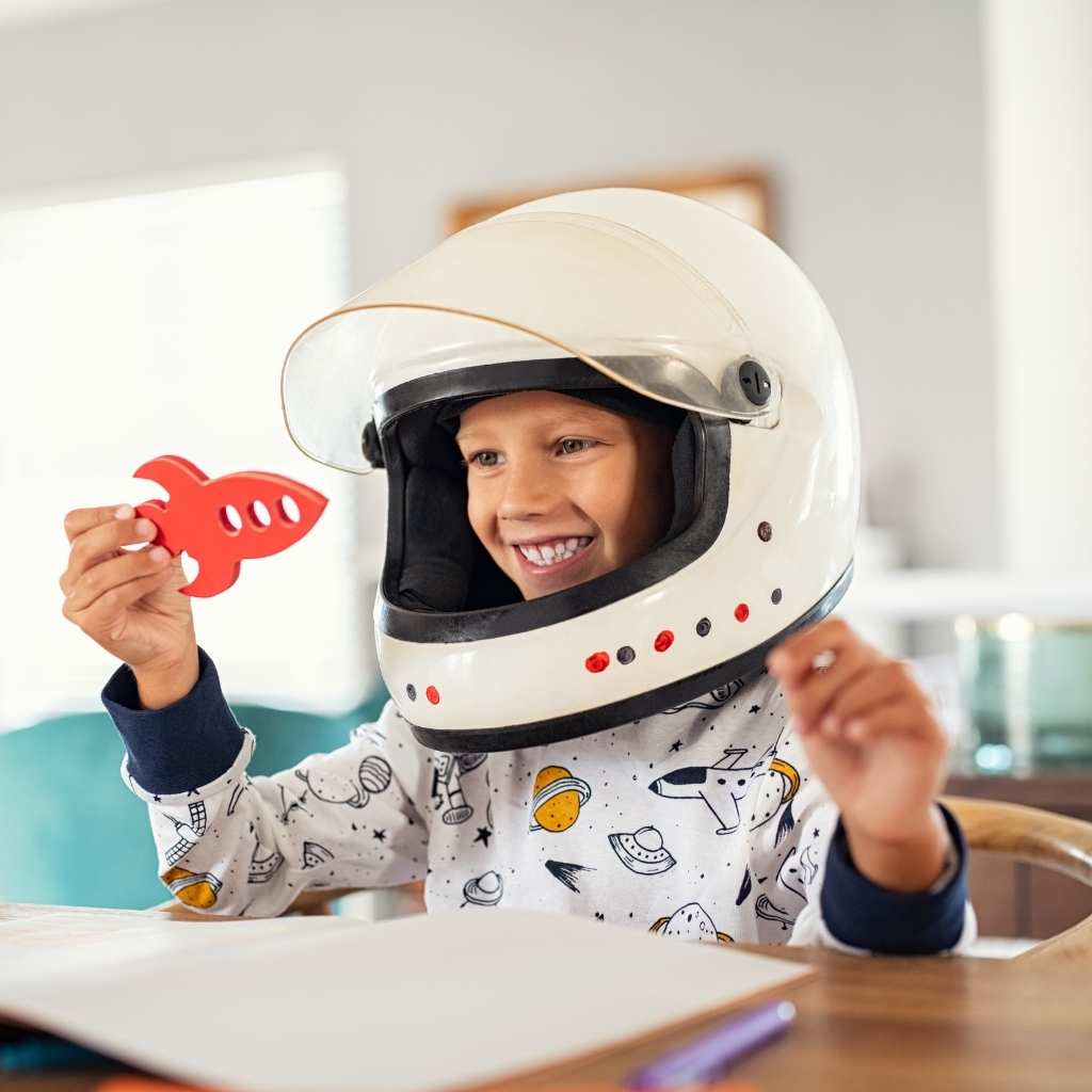 Child using imaginative play to explore personal interests