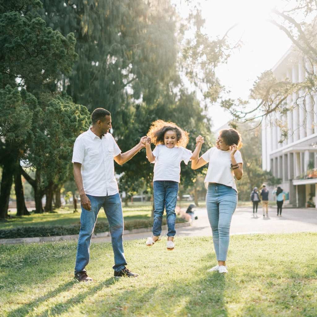 Family enjoying quality time outdoors while learning how to raise a child with autism