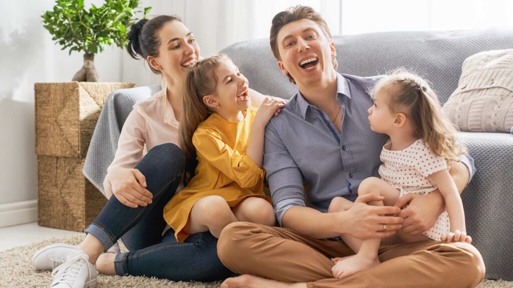 Family sharing joyful moments while learning how to raise a child with autism