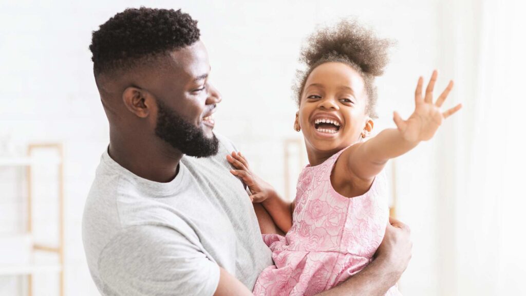 Parent and child enjoying a joyful moment together