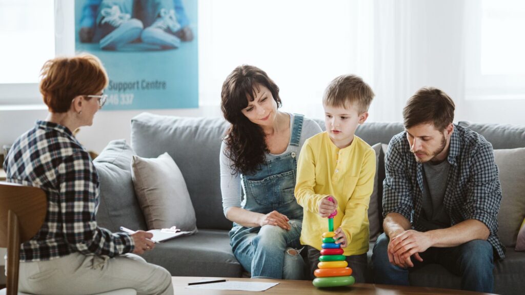 Parents and child talking with a professional during a family consultation
