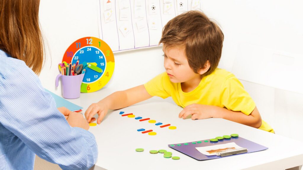 Child completing a learning activity with individualized support